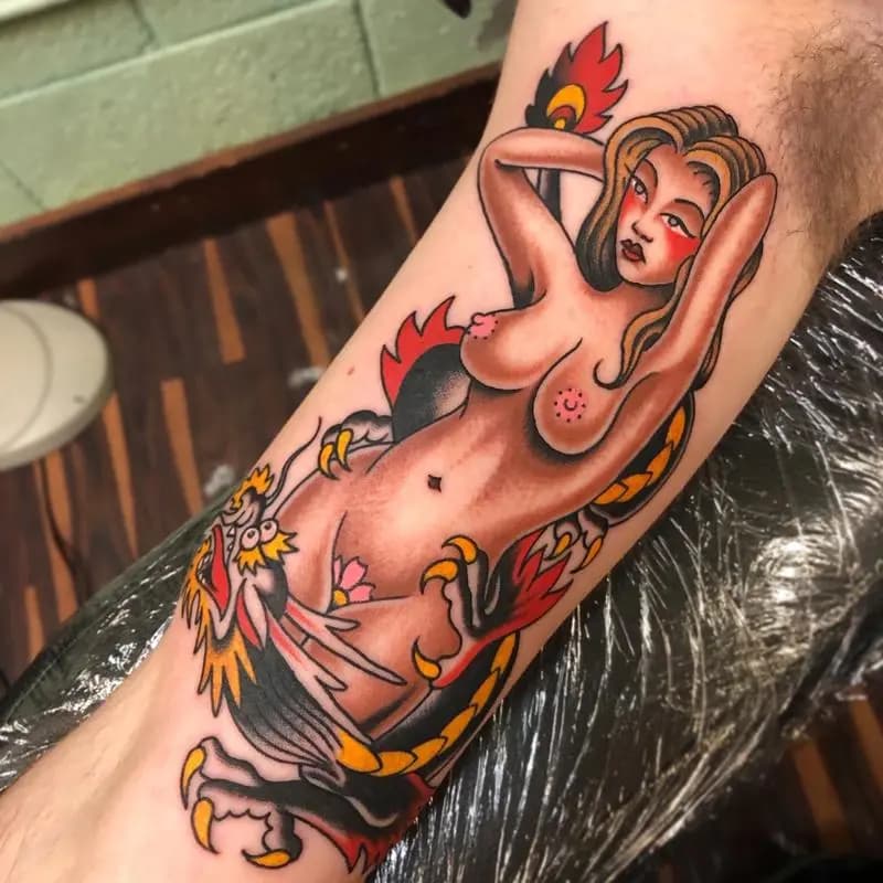 a tattoo of a woman in a person's arm