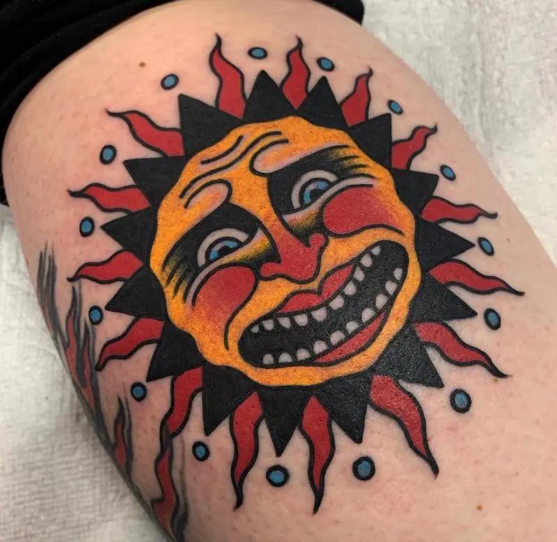 a tattoo of a sun 