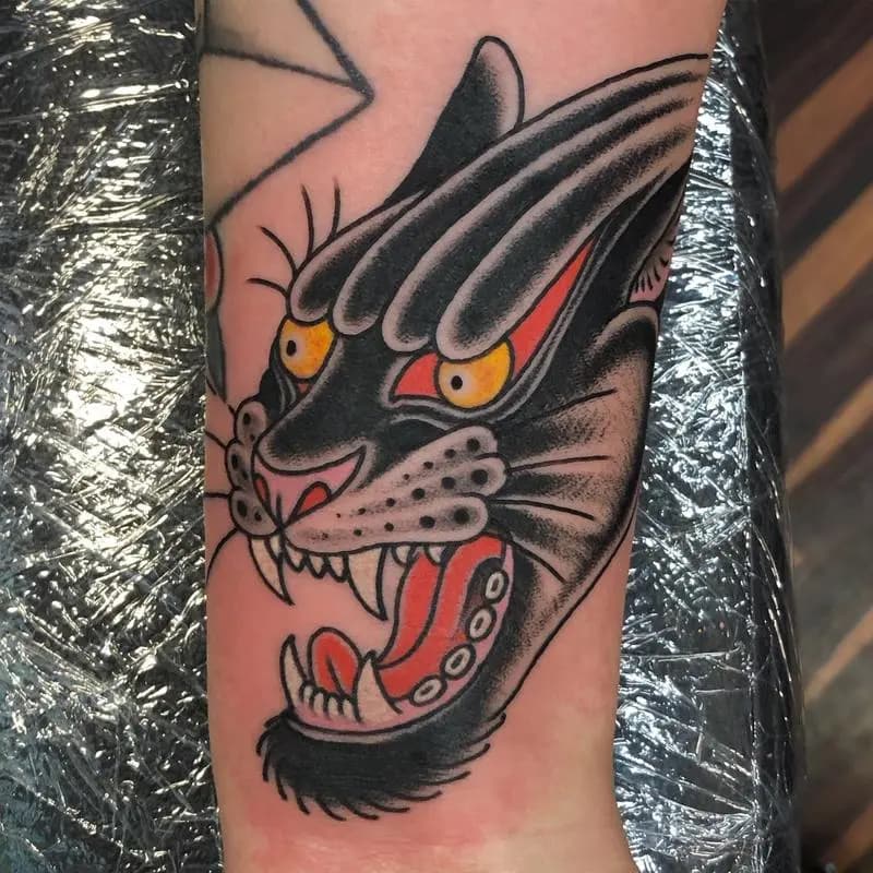 a tattoo of an animal in a person's arm