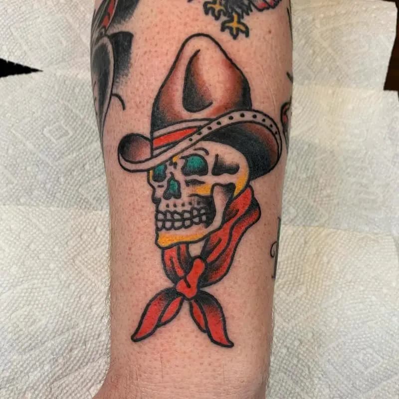 a skull with hat tattoo