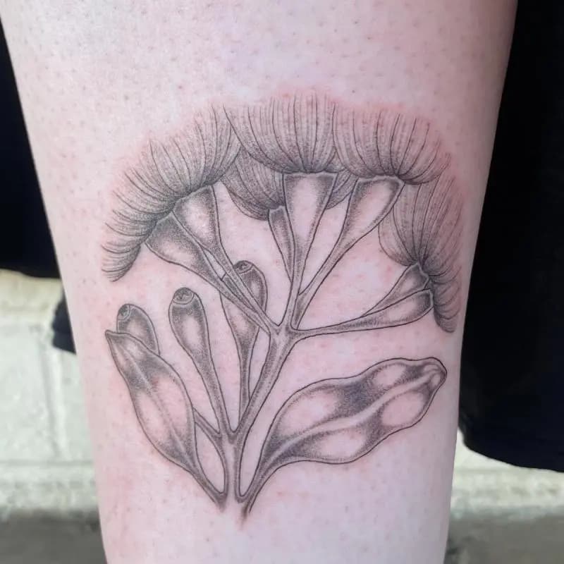 a flower tattoo on a person's arm