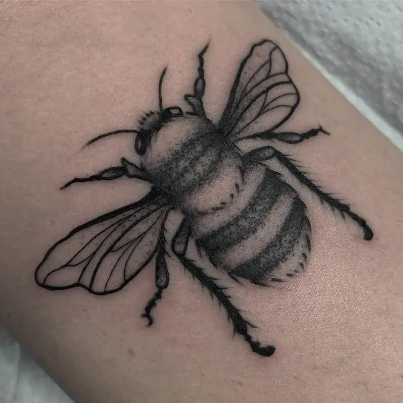 a tattoo of a bee