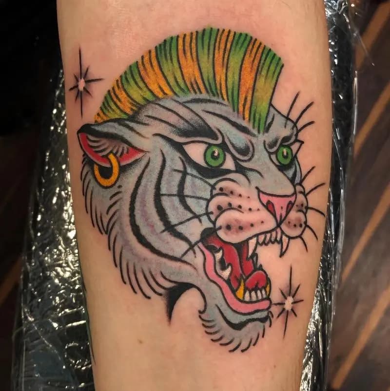 a tattoo of a tiger in a person's hand