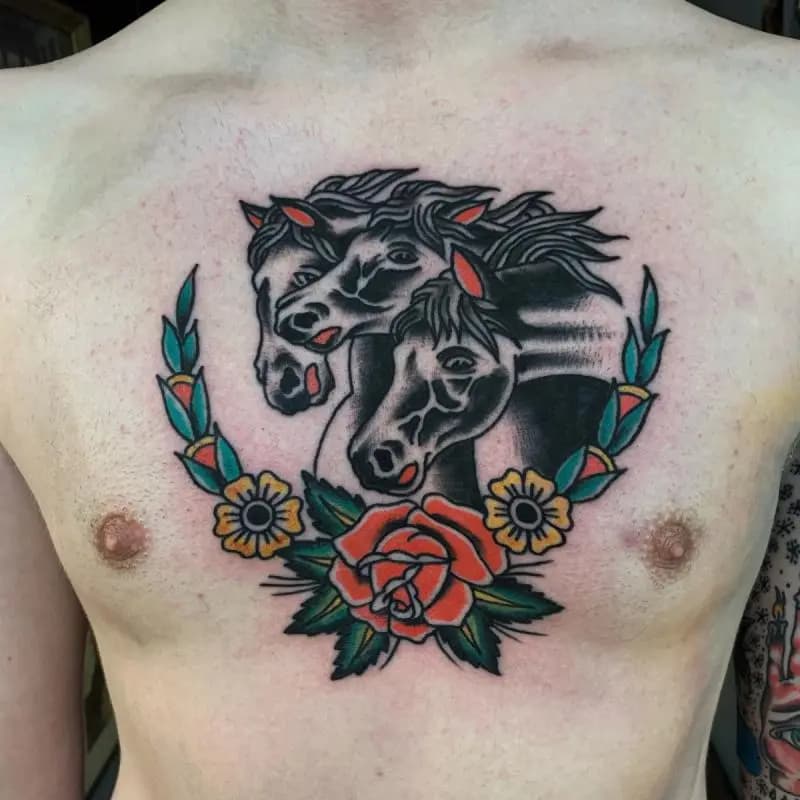 a horse tattoo in the middle of the cheast