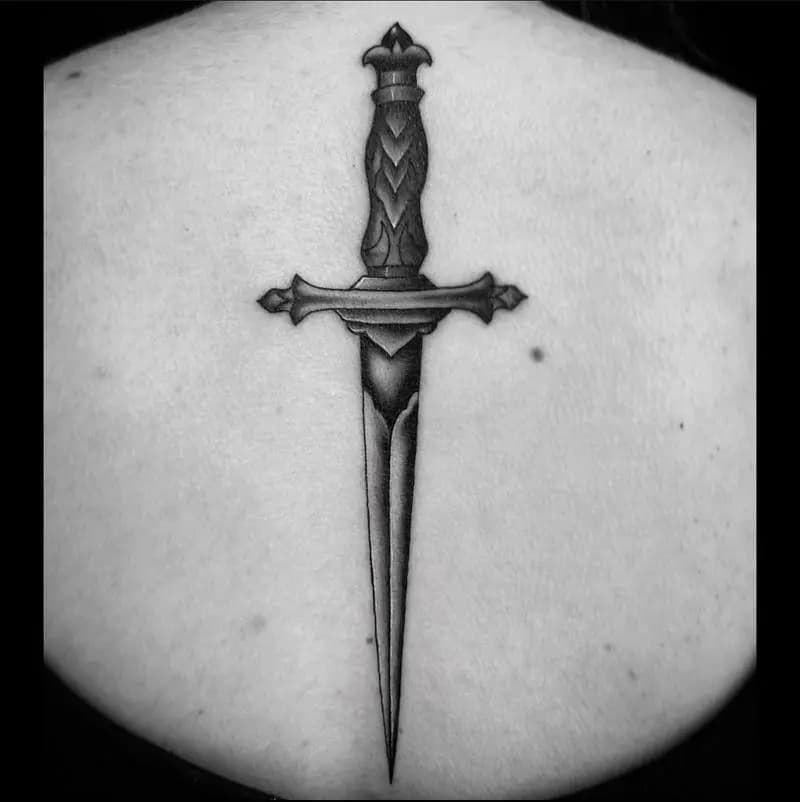 a tattoo of a sword