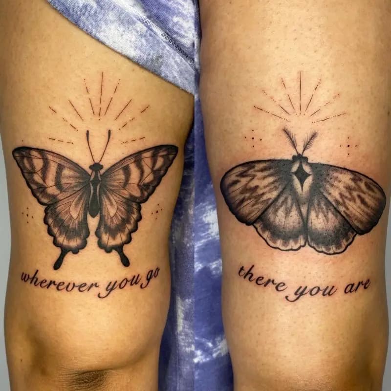 a tattoo of a butterfly with some text